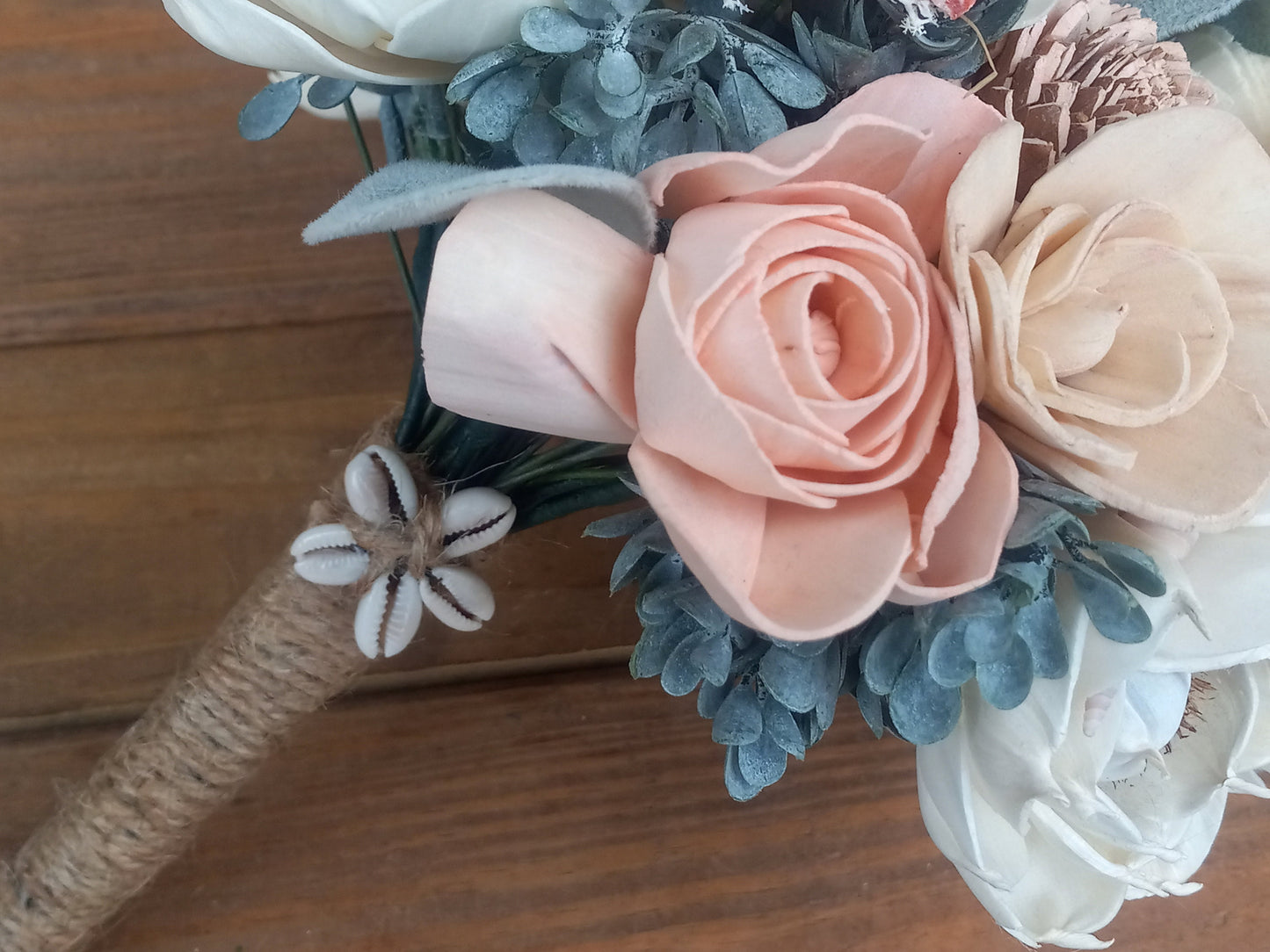Beach Theme Wedding Bouquet with a matching Boutonniere in Shades of Pinks and Peaches