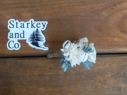 Beach Theme Wedding Bouquet with a matching Boutonniere in Shades of Pinks and Peaches