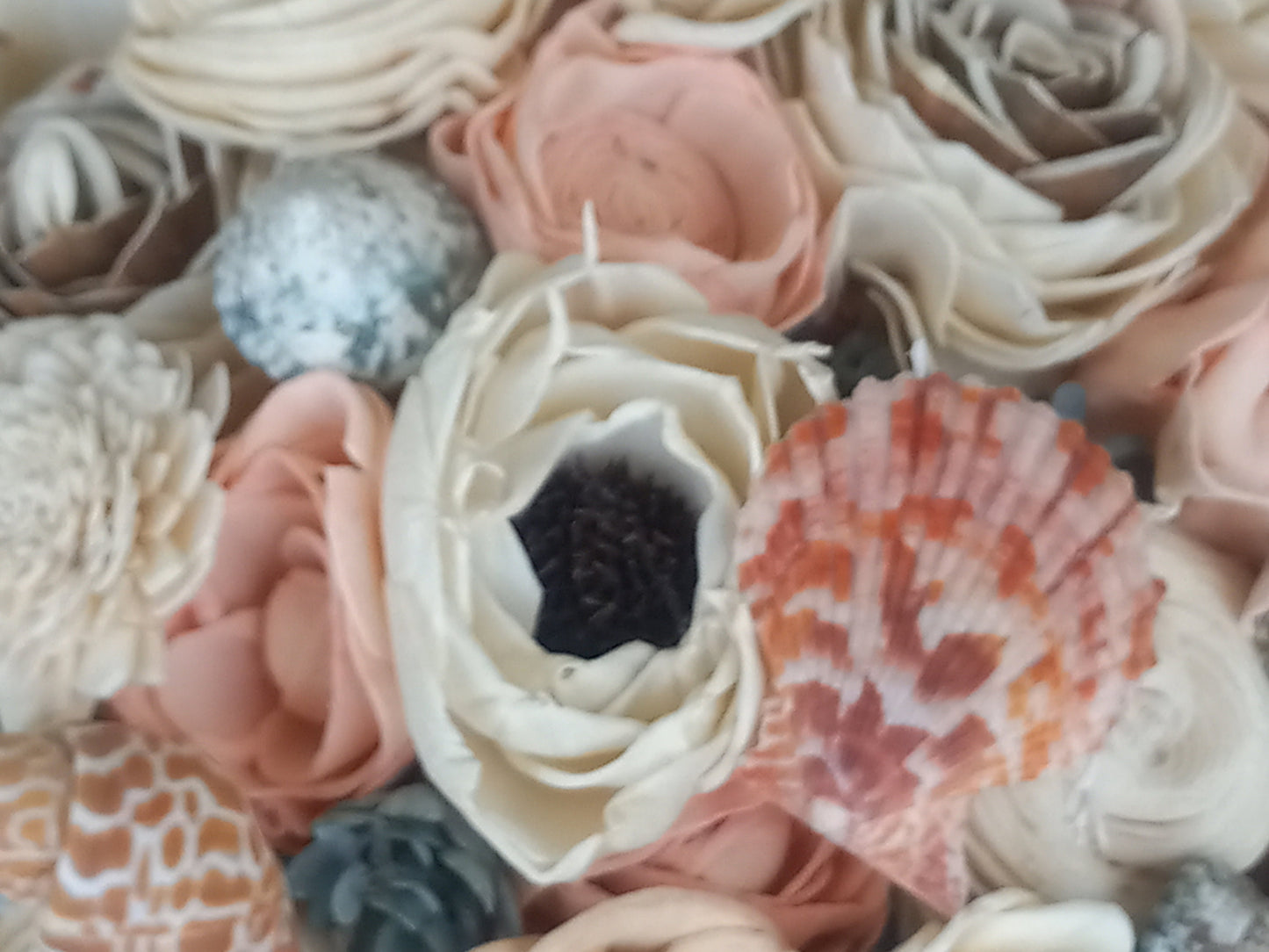 Beach Theme Wedding Bouquet with a matching Boutonniere in Shades of Pinks and Peaches